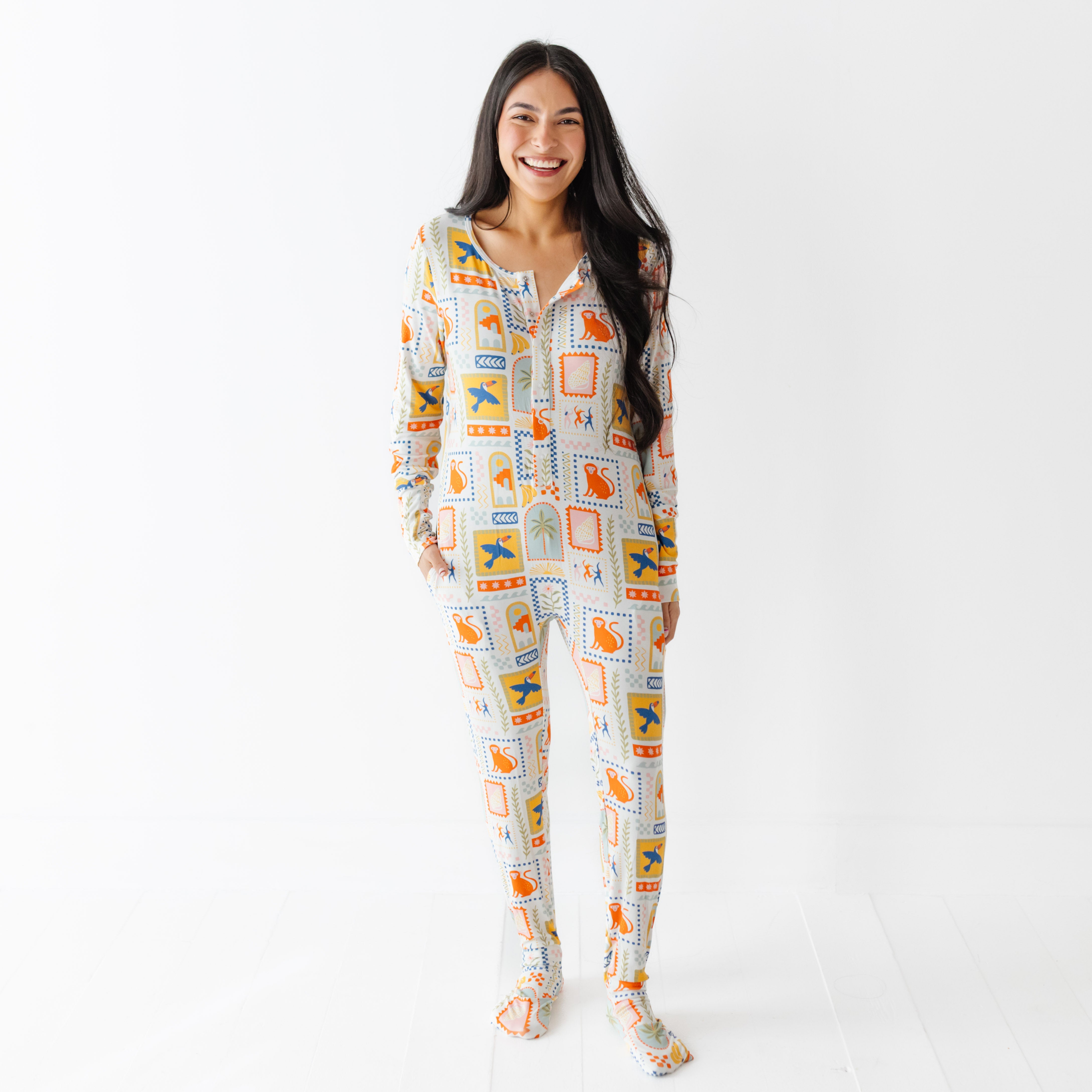 Woman wearing a patterned onesie on a white background