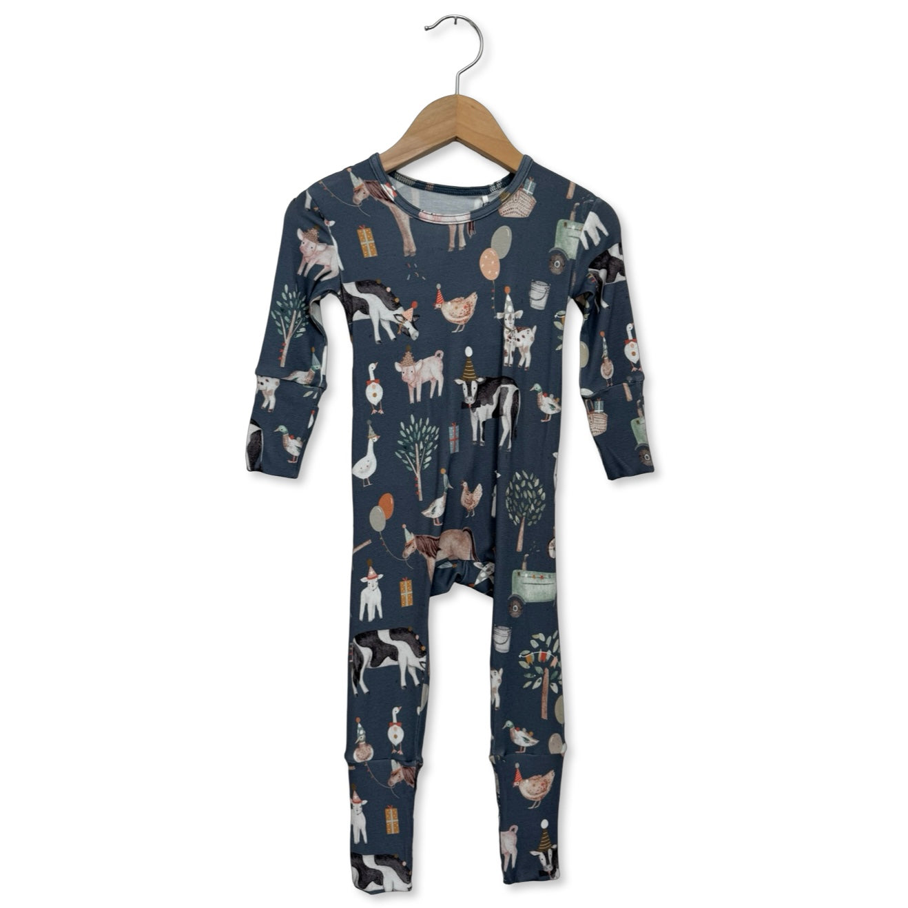 navy blue onesie with animal pattern on a hanger against a white background