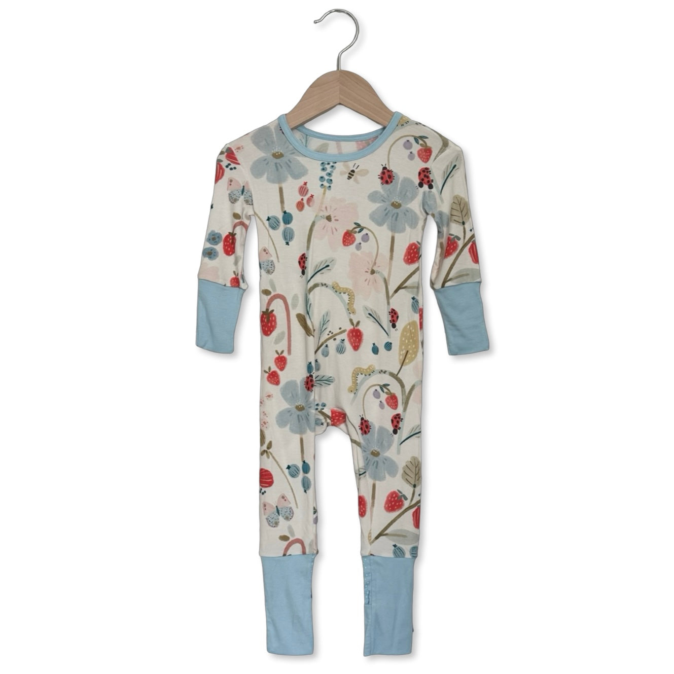 Floral-patterned baby onesie on a hanger against a white background