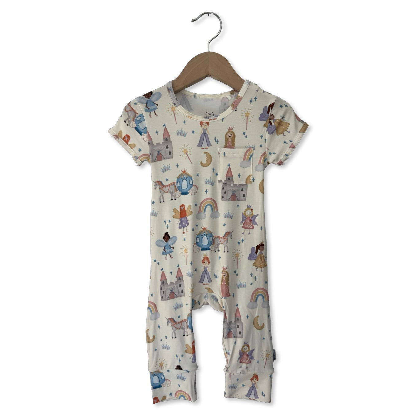 Baby romper with fairy tale design on a hanger against a white background