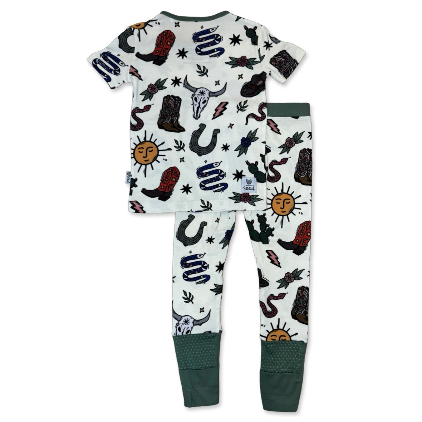 Children's pajama set with cowboy and western-themed design on a white background
