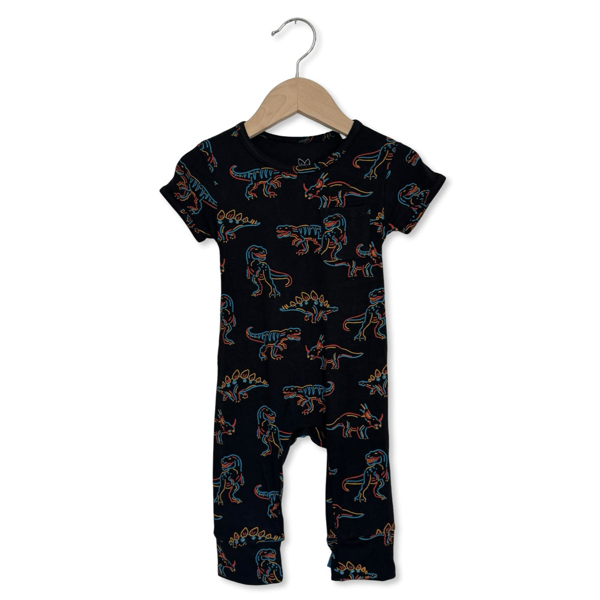 Black baby romper with dinosaur pattern on a hanger against a white background