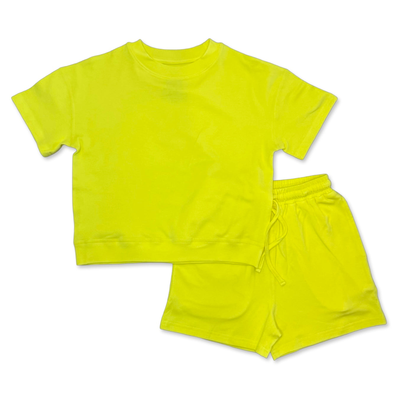 Yellow crop top and shorts set on a white background