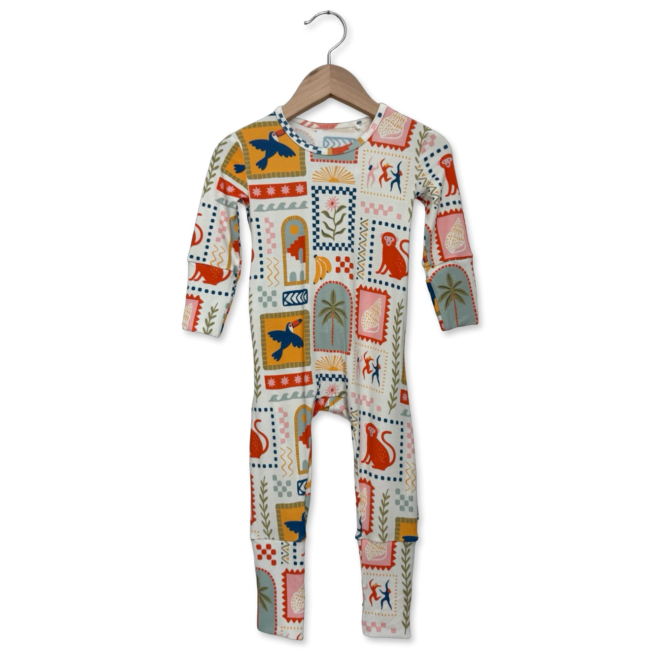 Children's onesie with colorful pattern on a hanger against a white background