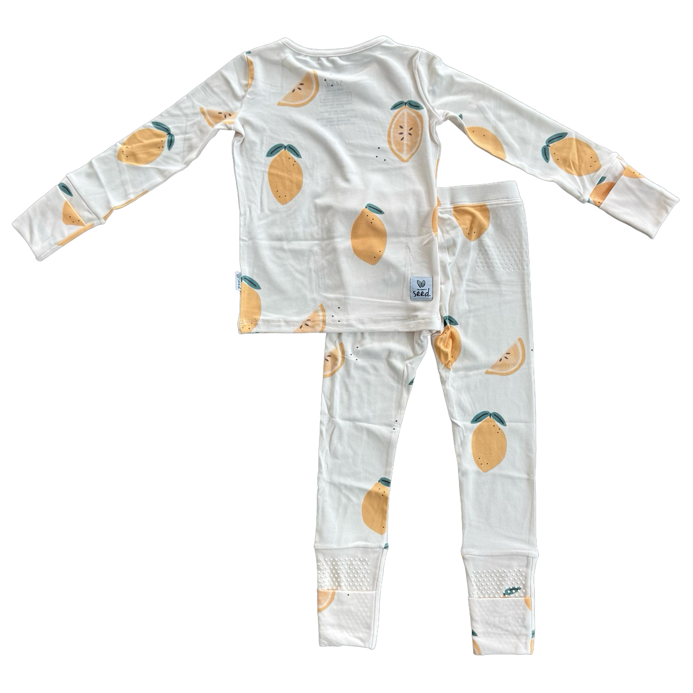 A two-piece children's pajama set consisting of a long-sleeve top and matching pants, printed with a pattern of yellow mangoes with green leaves on a white background.
