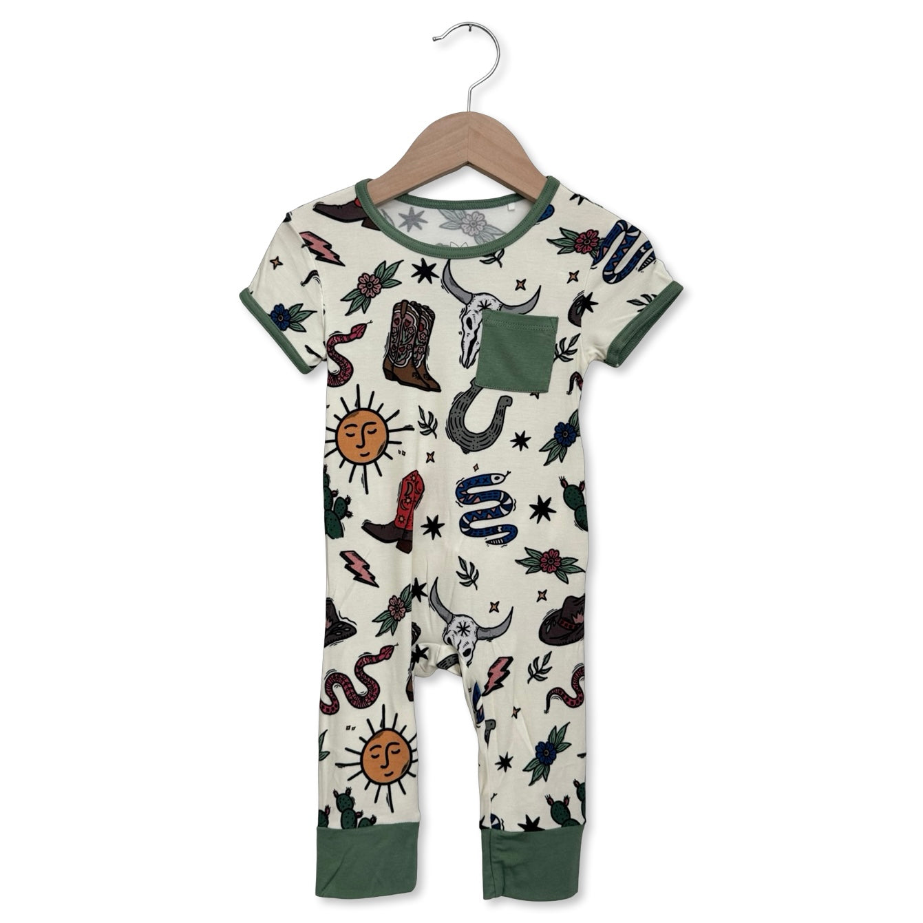 Children's onesie with tattoo-like design on a hanger against a white background