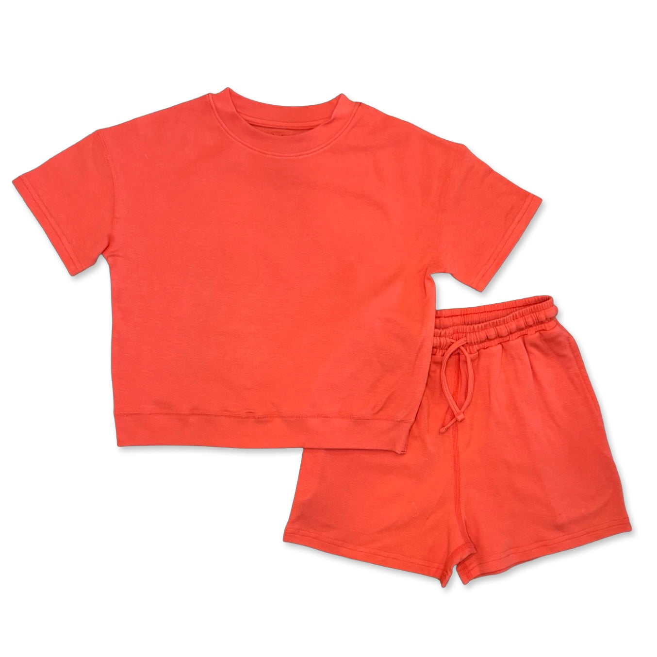 Orange t-shirt and shorts set on a white background