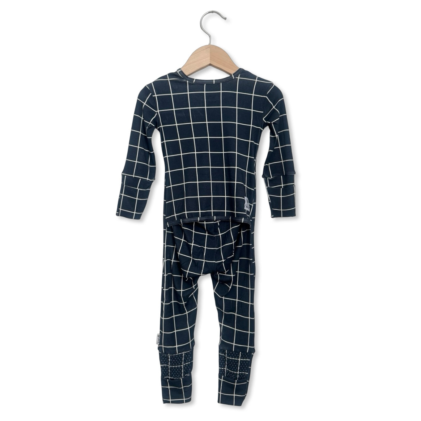 Children's navy grid pajama set on a hanger against a white background