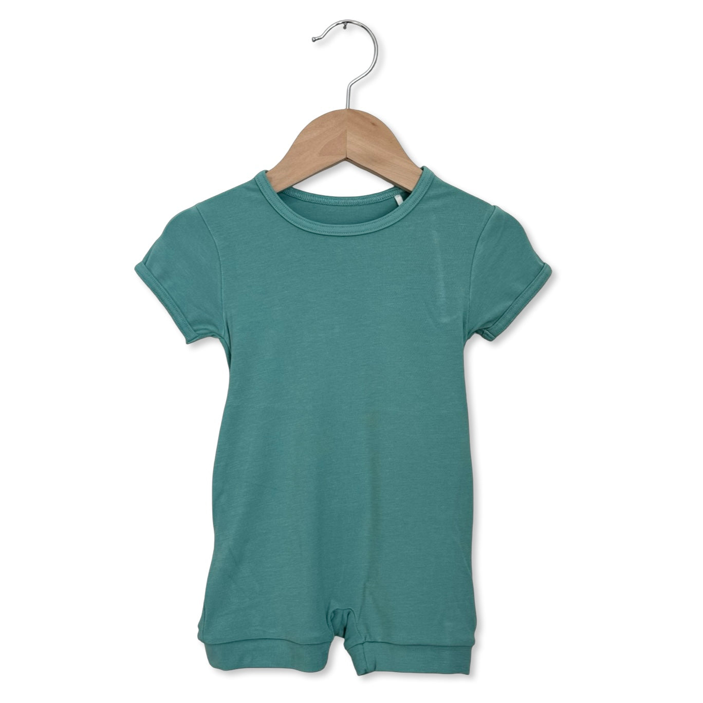 Teal baby romper on a wooden hanger against a white background