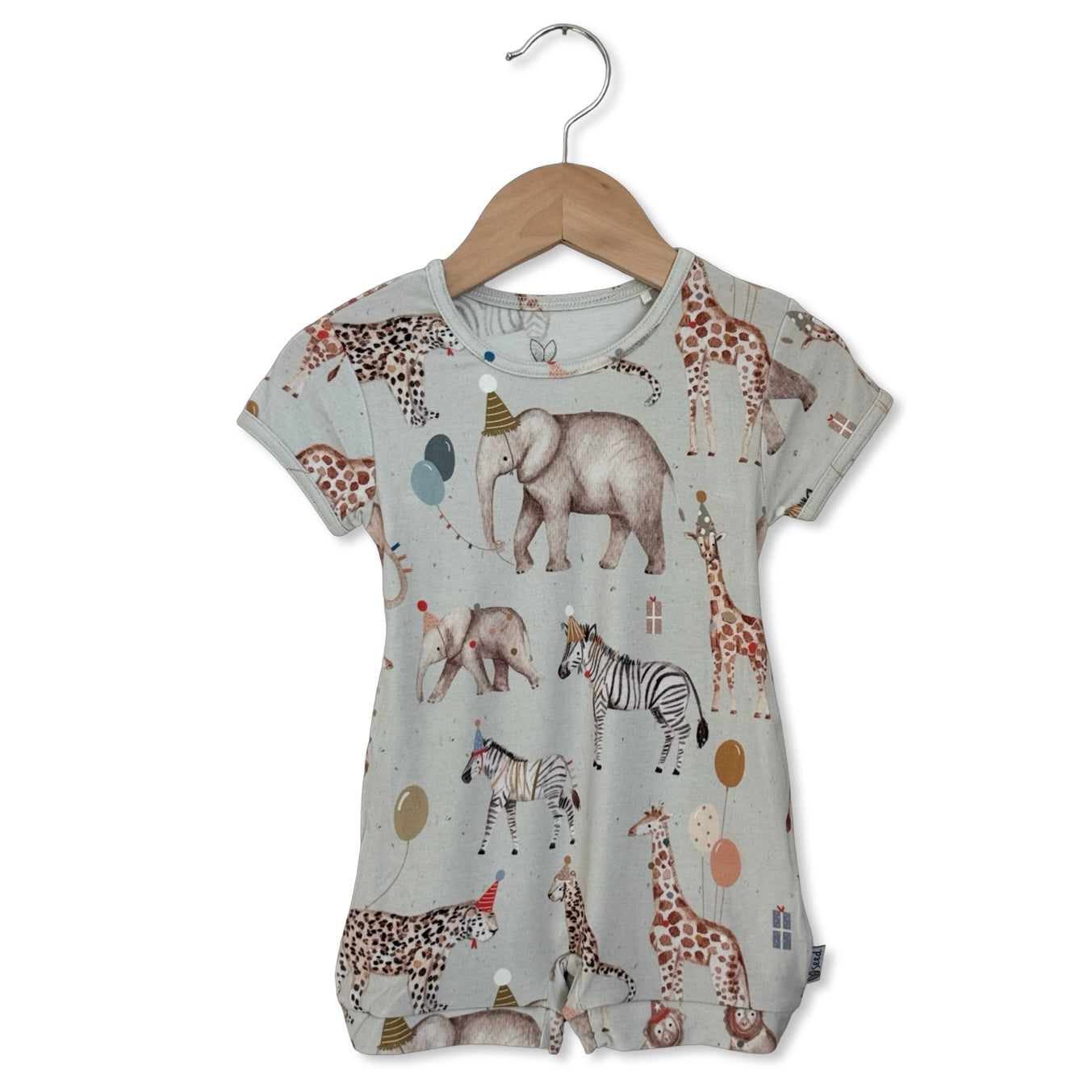 Children's t-shirt with animal pattern on a hanger against a white background
