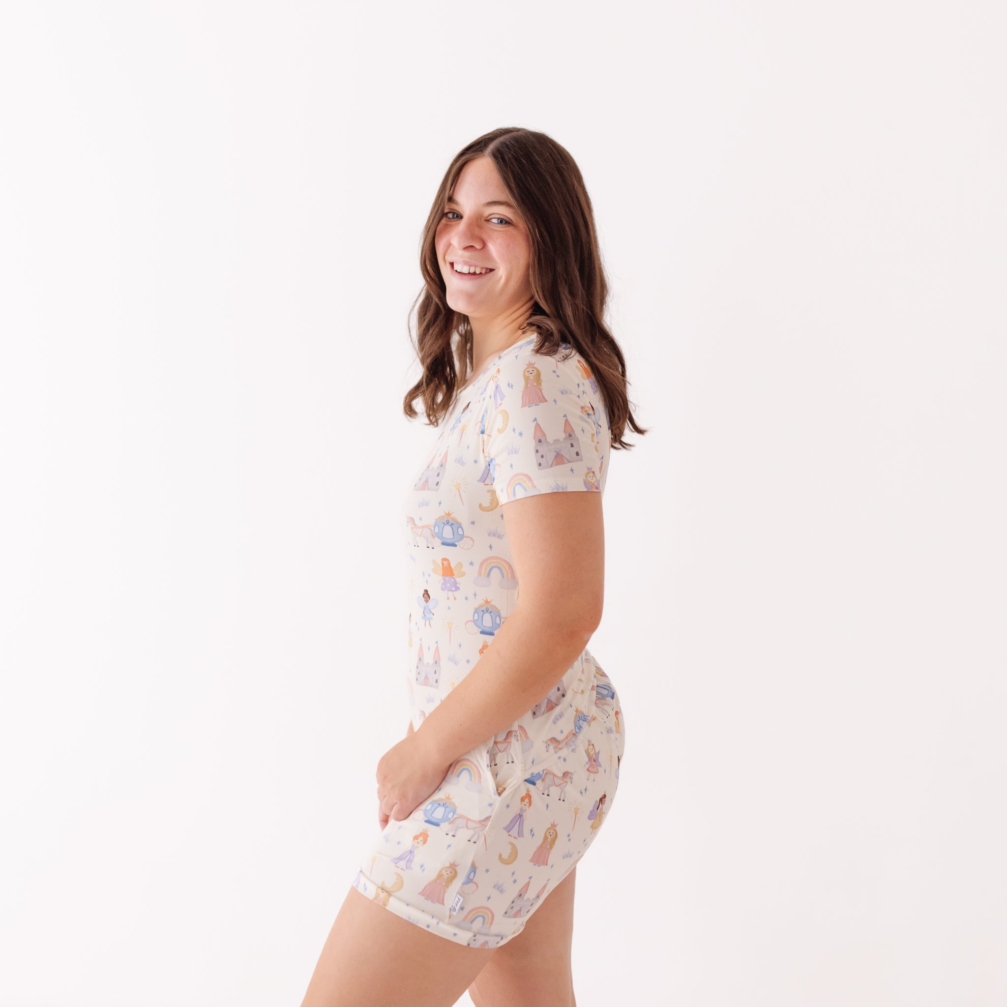 Woman wearing a patterned pajama set on a white background