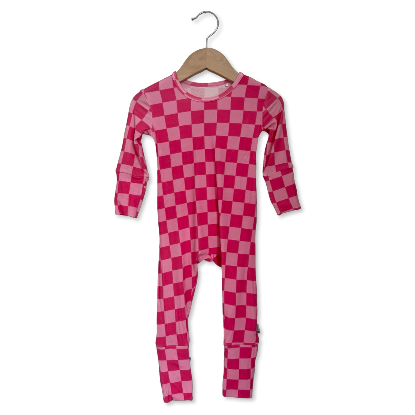 Pink checkered onesie on a hanger against a white background