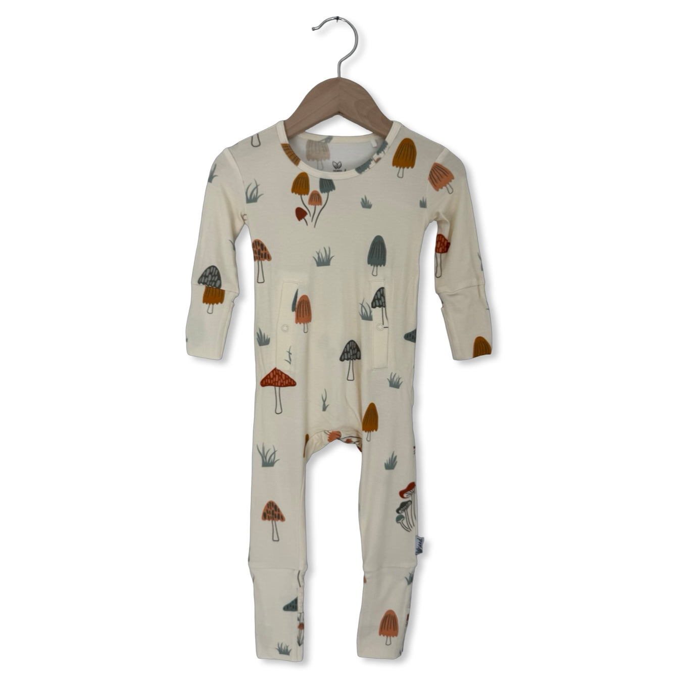 Baby onesie with mushroom pattern on a hanger against a white background