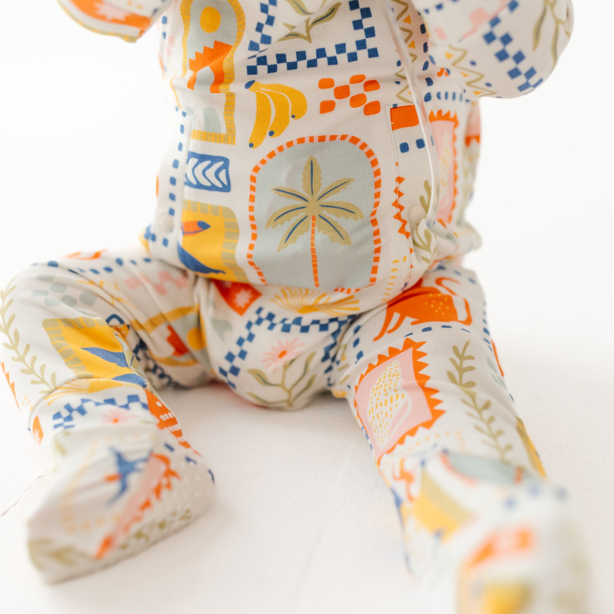 Colorful patterned plush toy on a white background