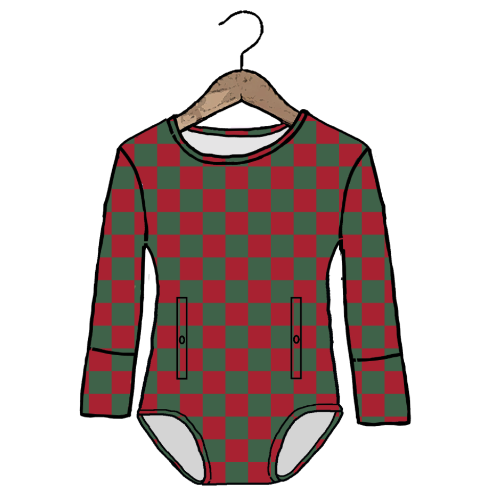 A long-sleeve baby bodysuit with a red and green checkered pattern, hanging on a wooden hanger against a plain white background.