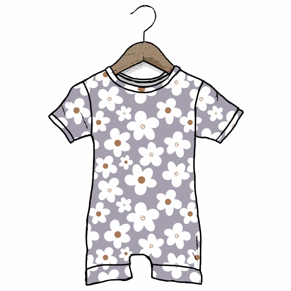 A short-sleeve baby romper with a white floral print on a light gray background, hanging on a wooden hanger against a plain white background.