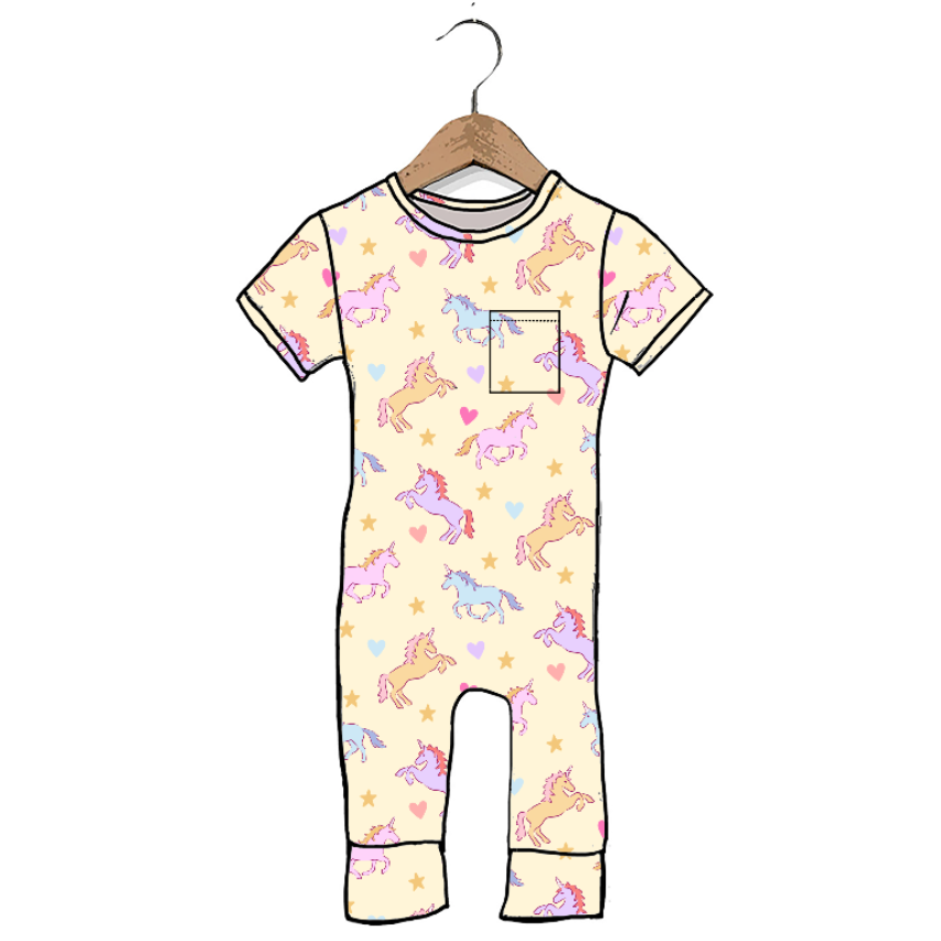 A short-sleeve baby romper with a pastel unicorn and star print on a cream background, hanging on a wooden hanger against a plain white background.