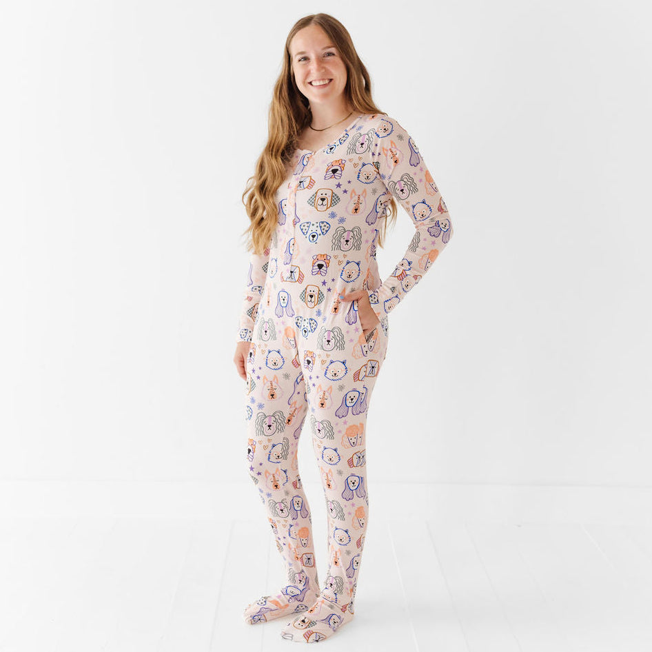 Woman wearing a patterned onesie on a white background