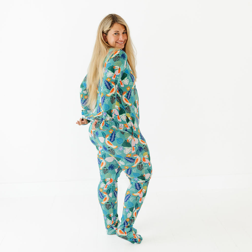 Woman wearing a colorful onesie with a pattern on a white background