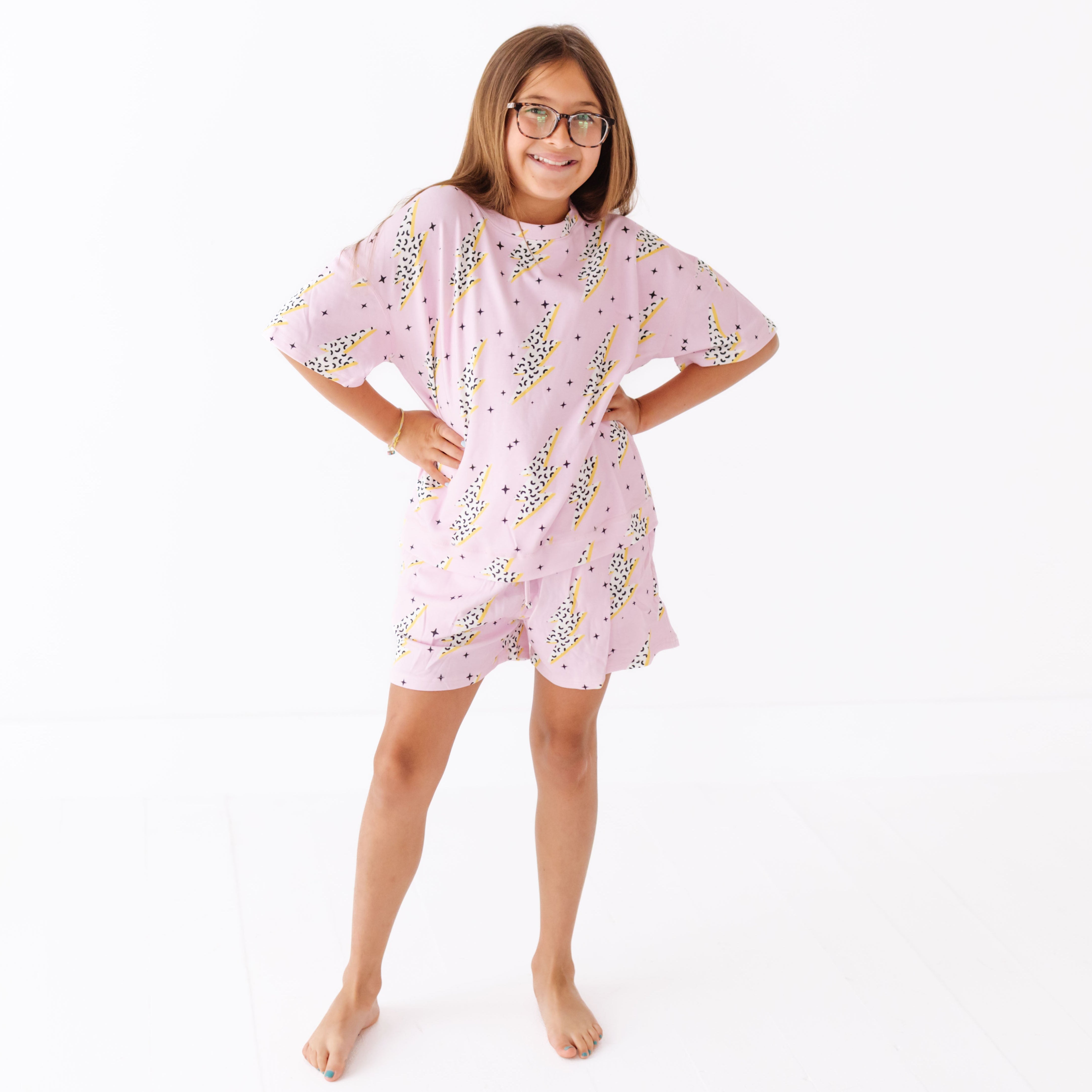 Person wearing a pink floral dress on a white background