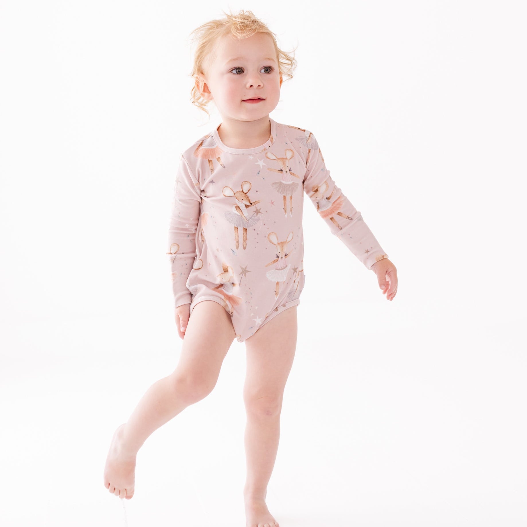 girl wearing pink mouse long sleeve onesie