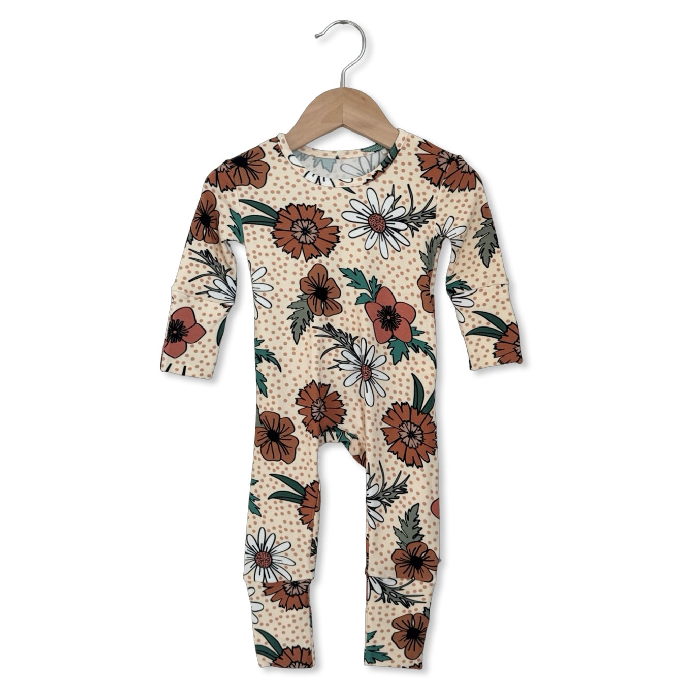 Floral-patterned baby onesie on a hanger against a white background