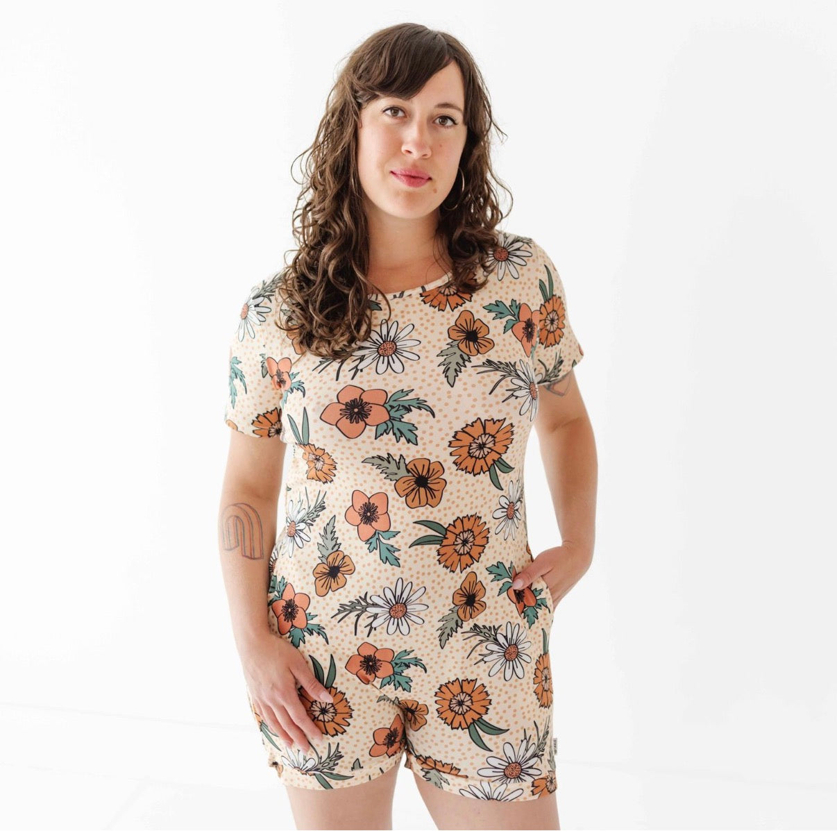 Woman wearing a floral-patterned outfit on a white background