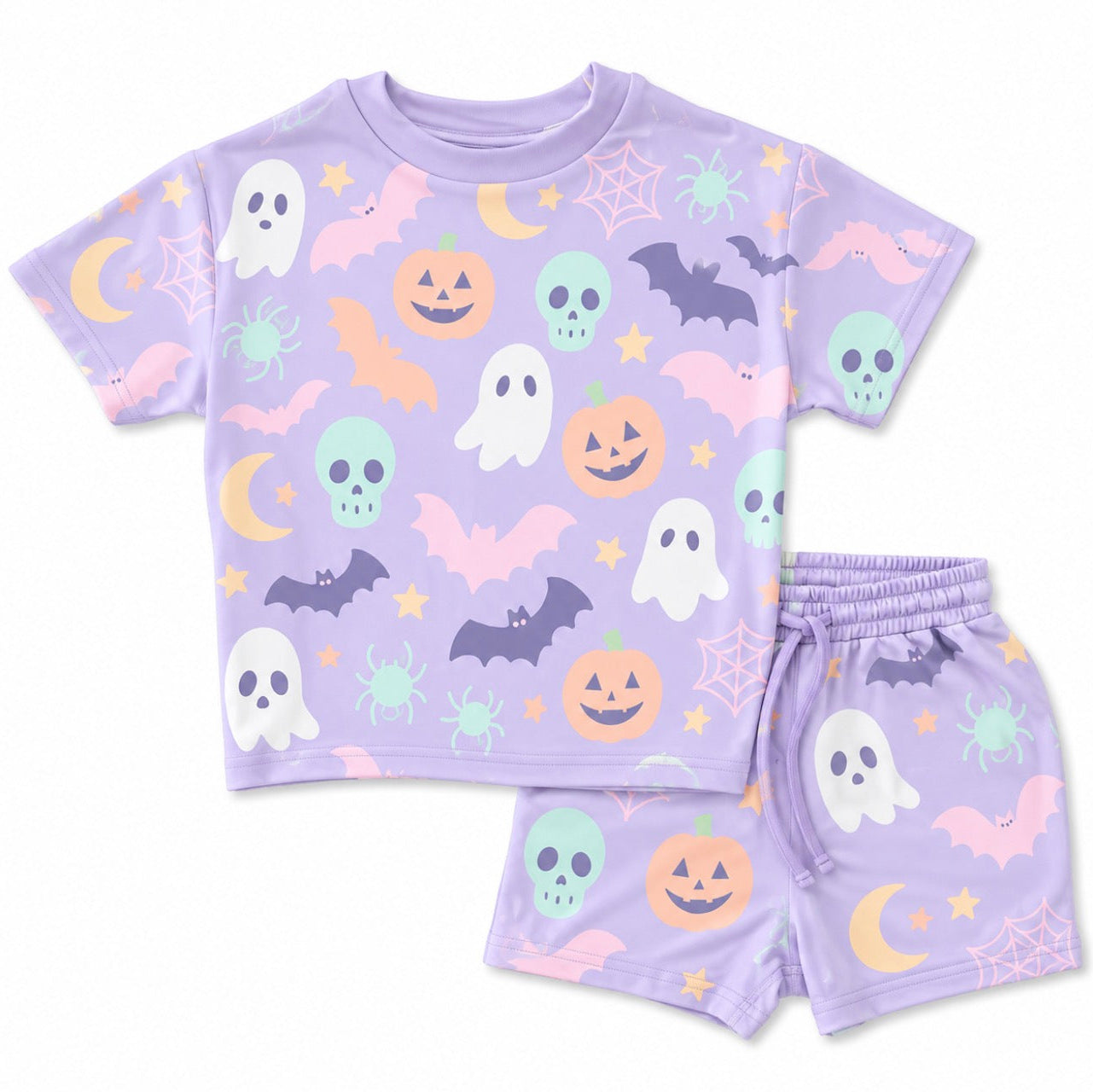 A children's two-piece pajama set featuring a short-sleeve t-shirt and matching shorts in light lavender purple, decorated with a colorful Halloween pattern of ghosts, pumpkins, bats, spiders, moons, and stars.