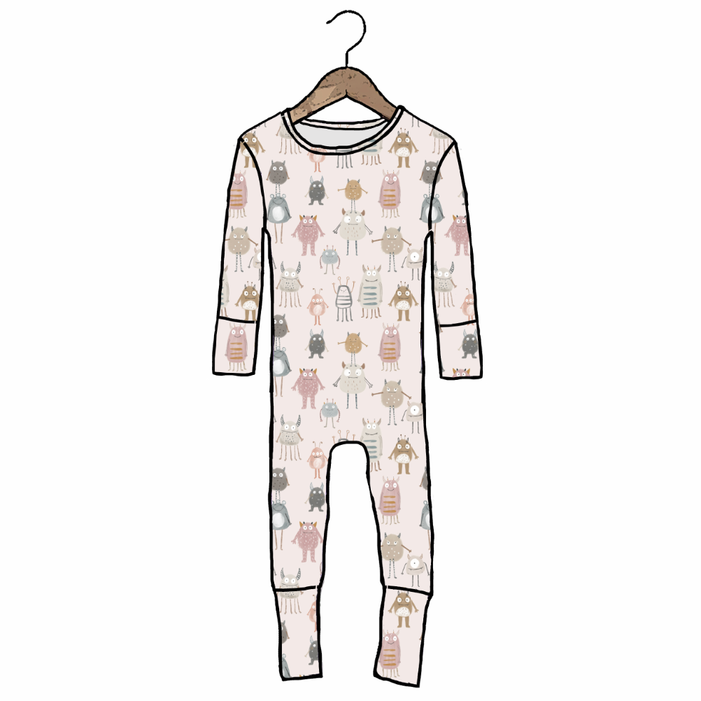 Children's onesie with animal pattern on a hanger against a white background
