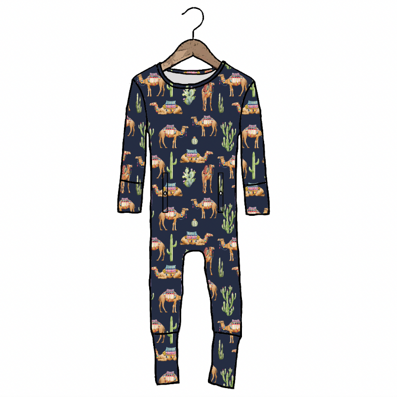 Children's onesie with camel and desert pattern on a hanger against a white background