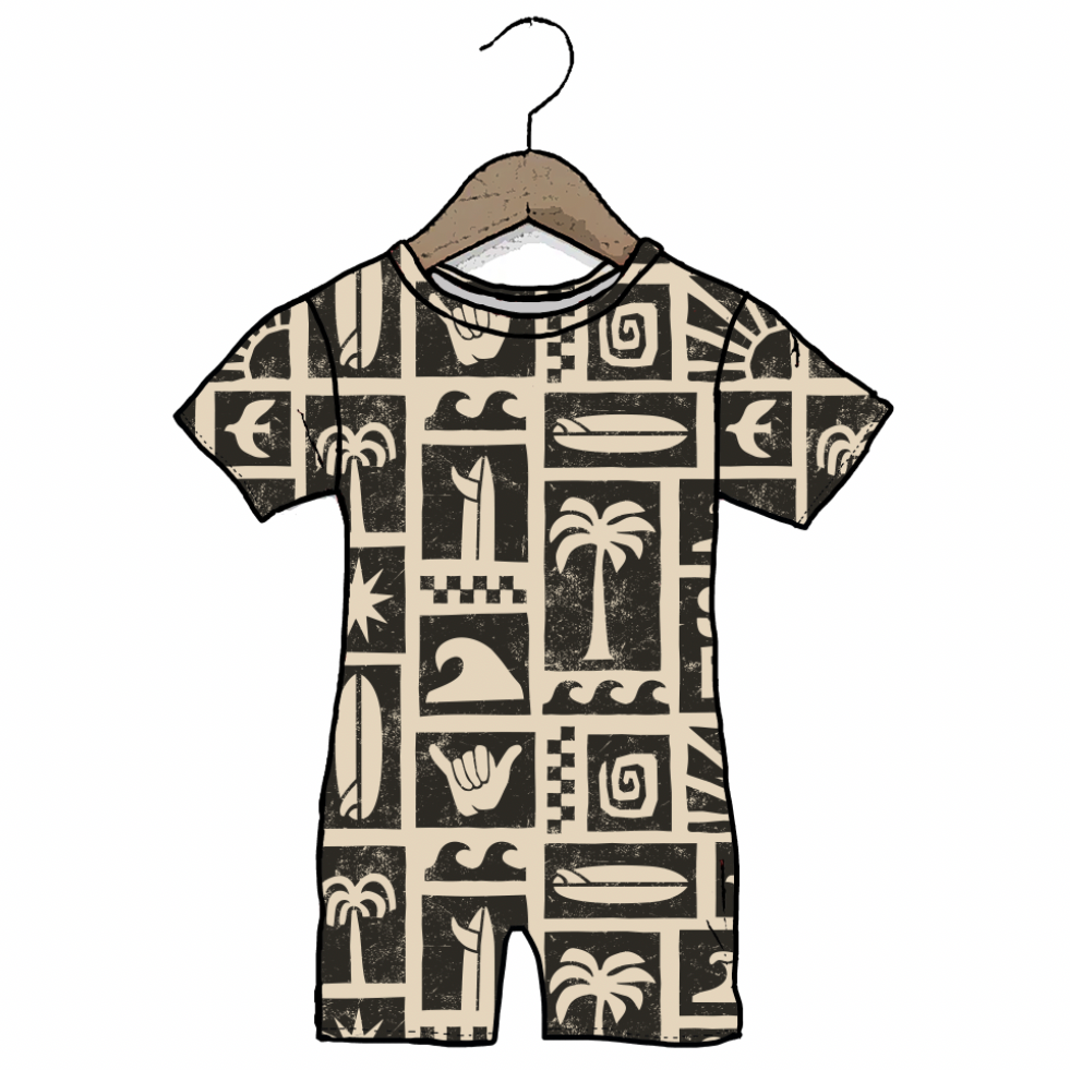 Children's romper with a pattern of palm trees, surfboards, and other symbols on a hanger against a white background.