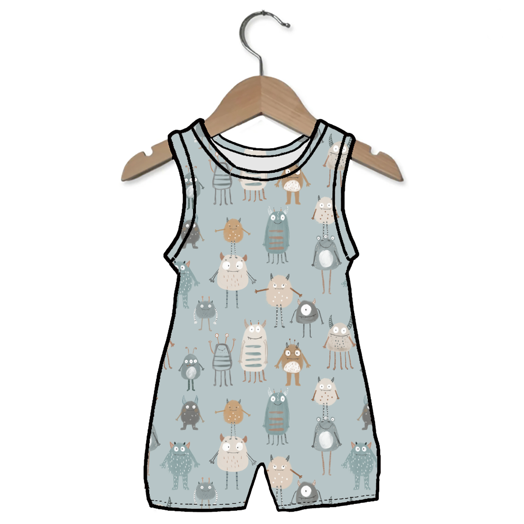 Baby romper with animal pattern on a hanger against a white background