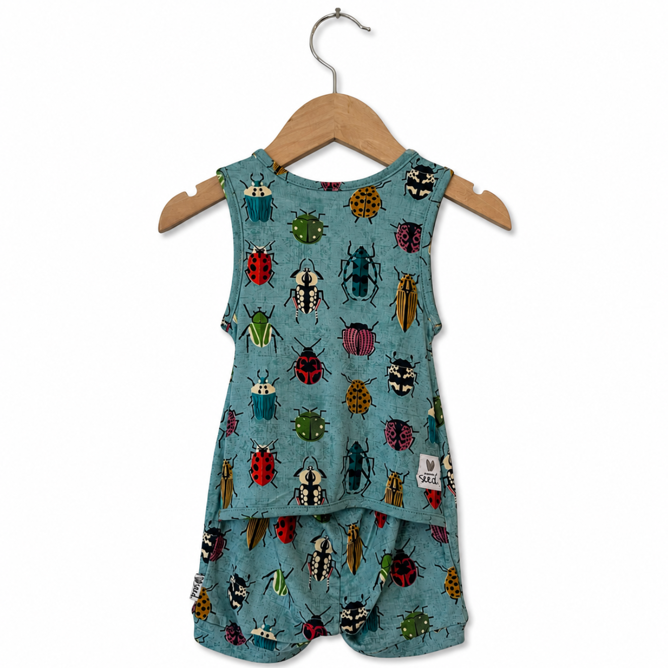 Children's sleeveless top and shorts set with insect pattern on a hanger against a white background
