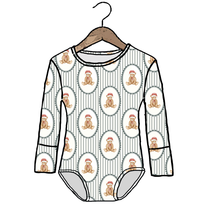 A long-sleeve baby bodysuit with an all-over print of teddy bears in Santa hats, shown hanging on a wooden hanger against a plain white background.