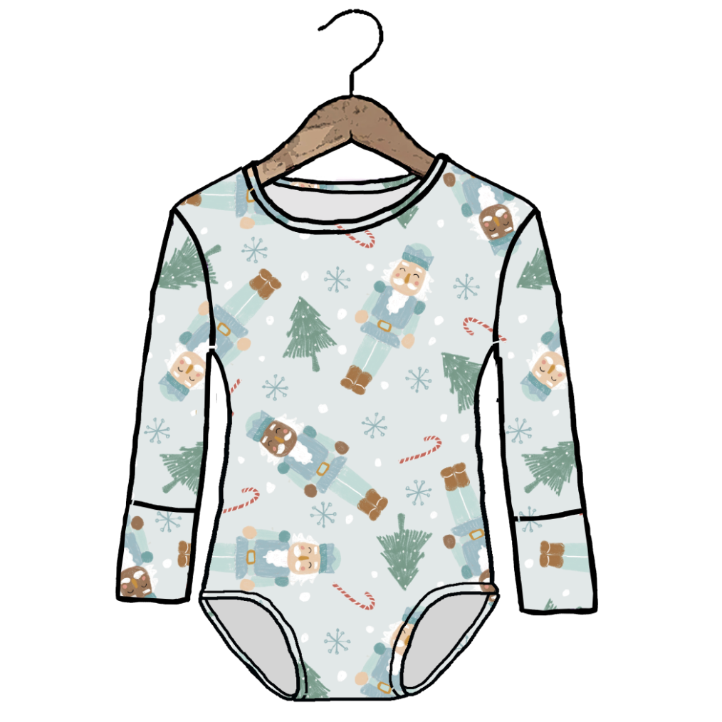 A long-sleeve baby bodysuit with a holiday nutcracker print, shown hanging on a wooden hanger against a plain white background.