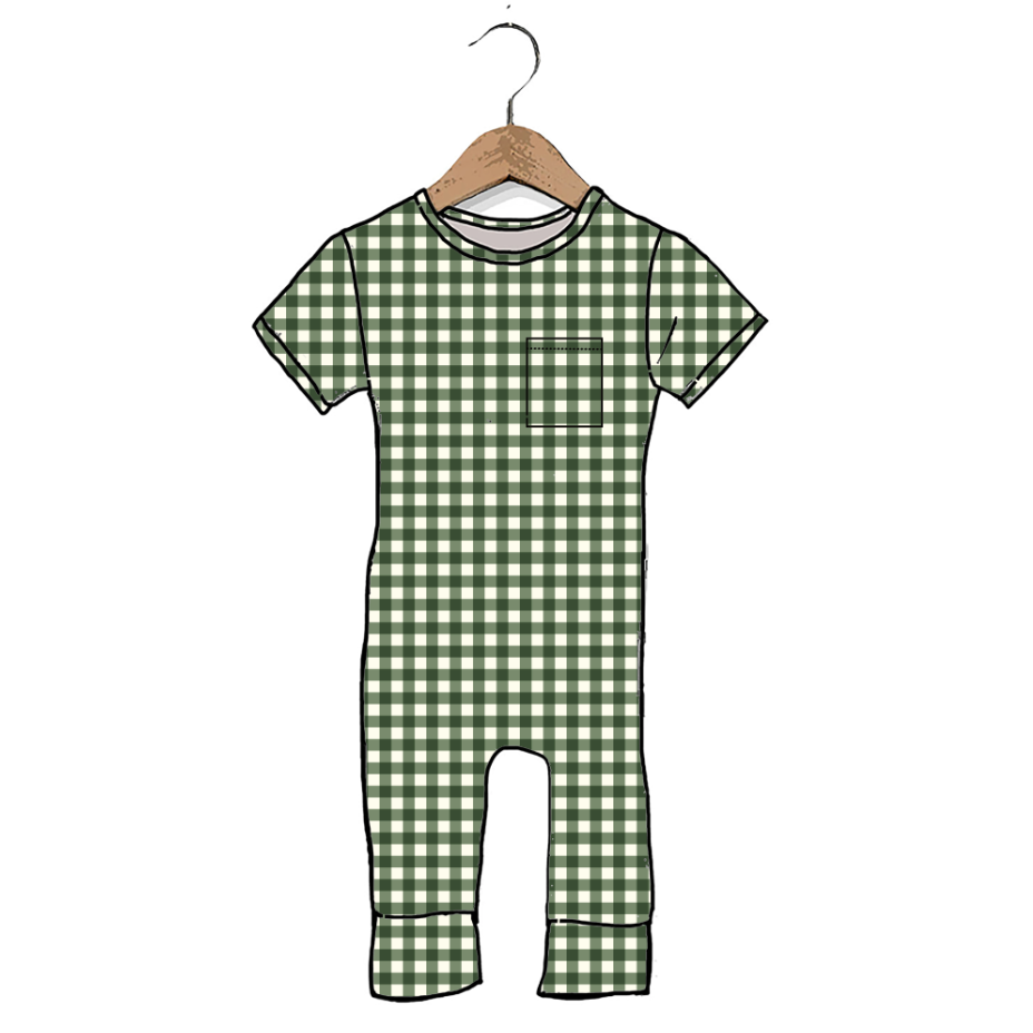 A short-sleeve baby romper with a green and white gingham check pattern, featuring a chest pocket and leg cuffs, shown hanging on a wooden hanger against a plain white background.