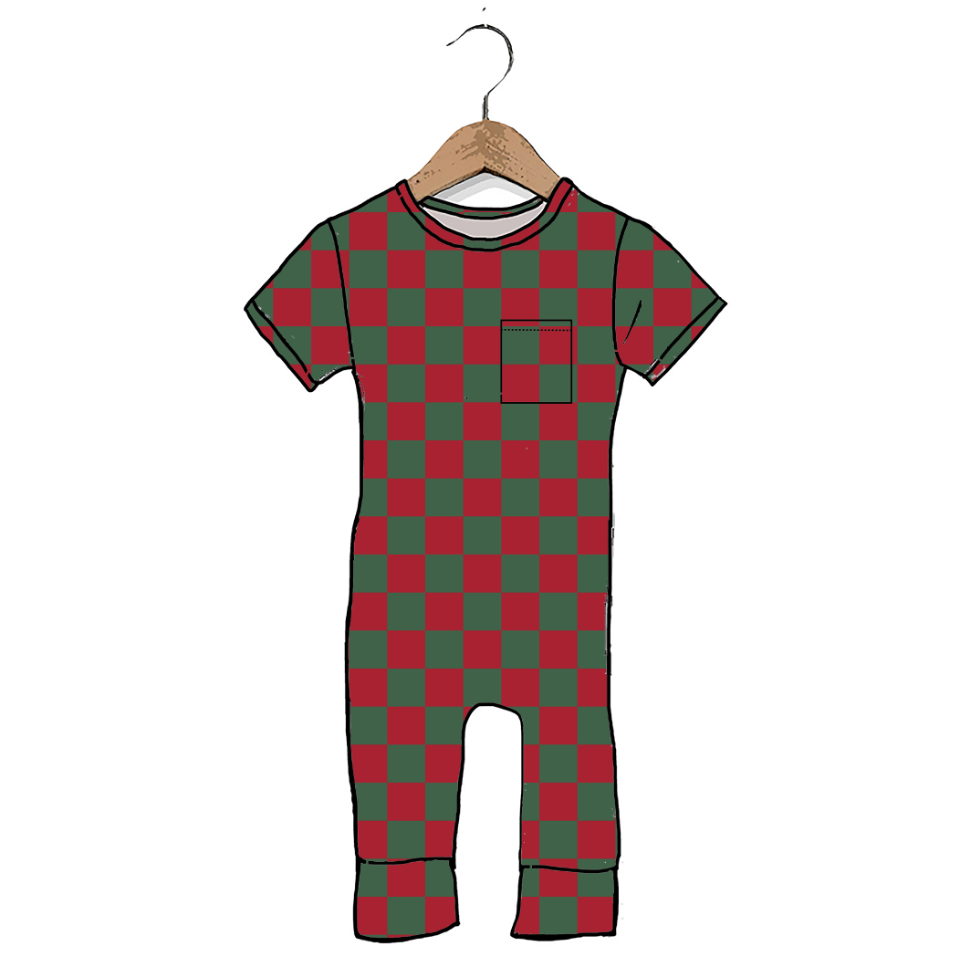 A short-sleeve one-piece jumpsuit with a red and dark green checkered pattern, hanging on a wooden hanger against a plain white background.