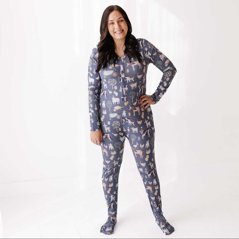 Woman wearing a patterned onesie on a white background