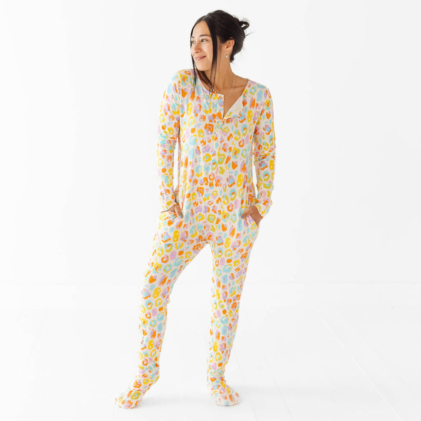 Woman wearing a floral onesie on a white background