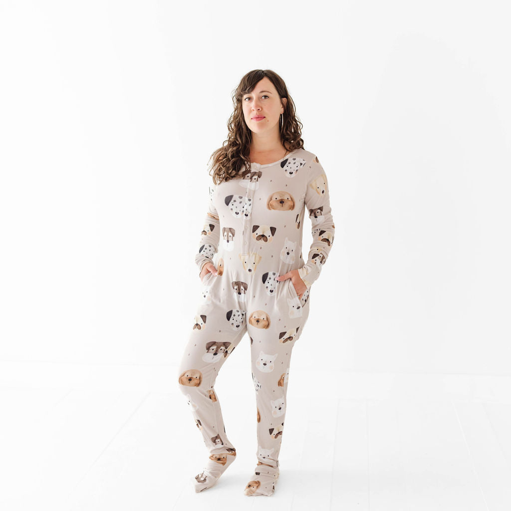 Person wearing a patterned onesie on a white background