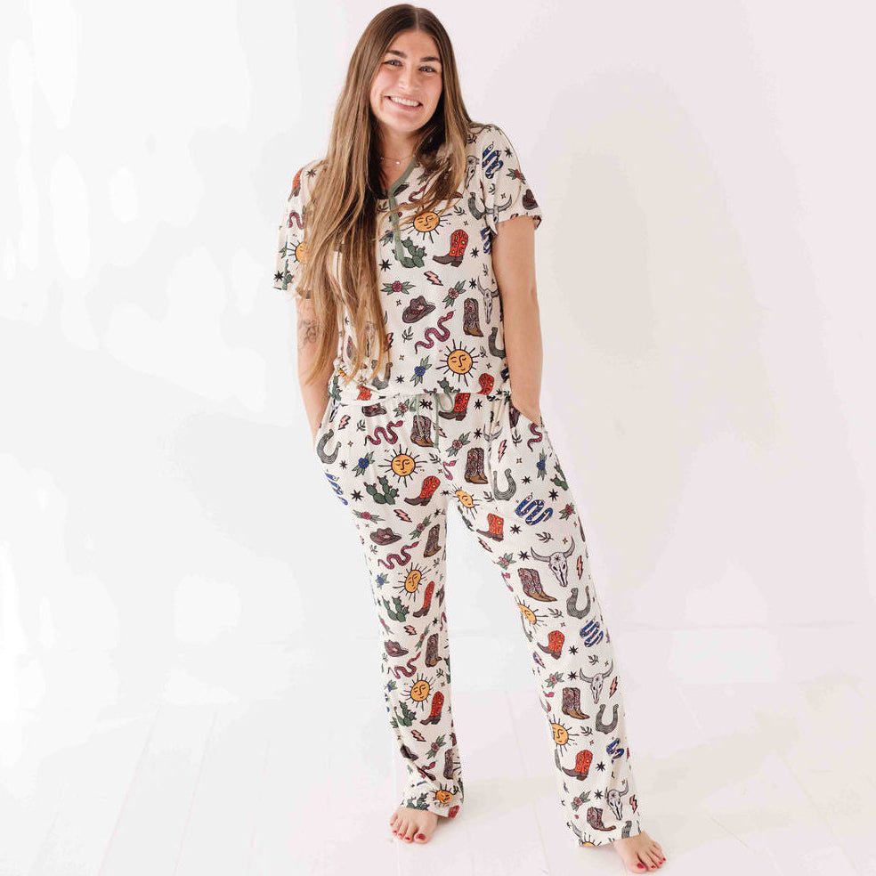 Woman wearing a colorful patterned onesie on a white background